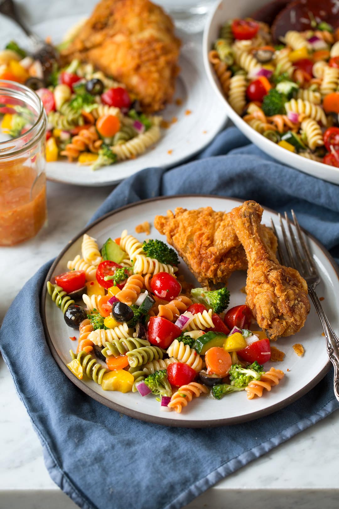 Insalata Di Pasta Da Giardino Garden Pasta Salad on a plate with fried chicken