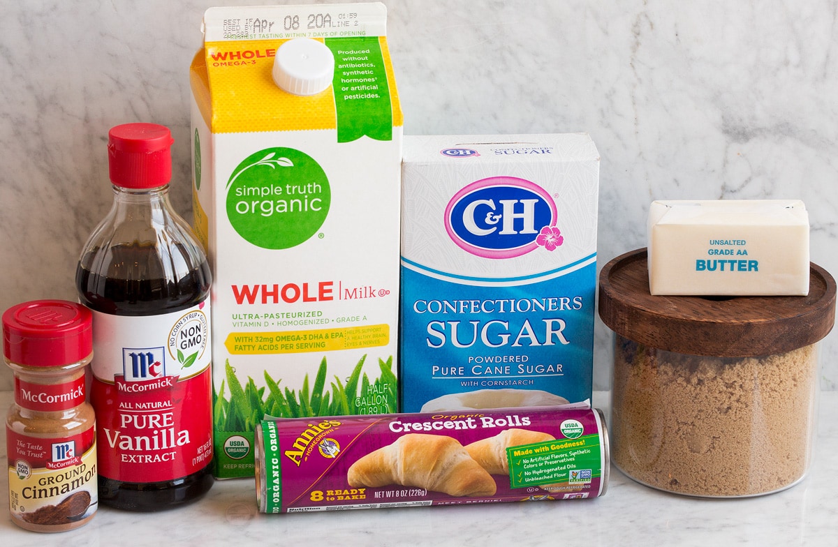 Easy Mini Panini Alla Cannella Photo of ingredients used to make mini cinnamon rolls. Includes crescent dough, brown sugar, butter, powdered sugar, milk, vanilla and cinnamon.